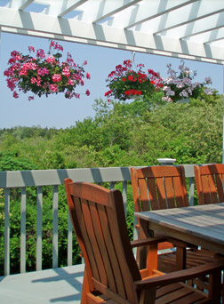 Enjoy breakfast on the deck at the High Pointe Inn Bed and Breakfast on Cape Cod